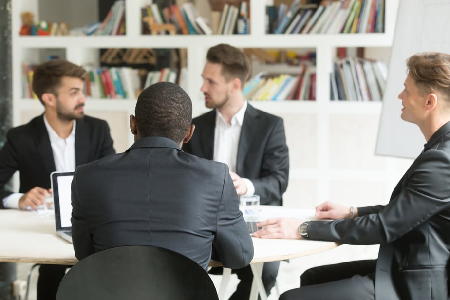 multiethnic-team-male-coworkers-discussing-corporate-plans-briefing